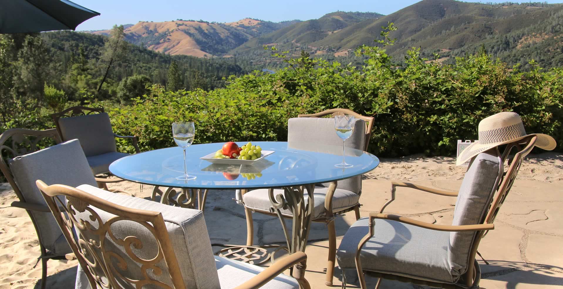 Breakfast table on the pool patio with mountain views